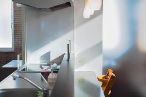 a kitchen with a sink and a counter top at STAY IN TOYOOKA in Asahikawa +21 photos