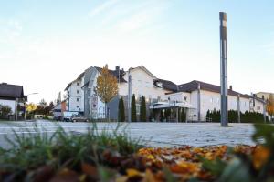 a building on a street with a parking lot at Arthotel ANA Panorama, Trademark Collection by Wyndham in Marktoberdorf