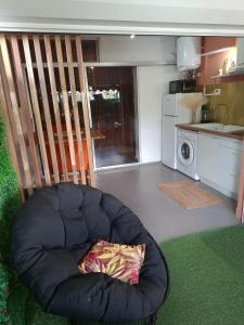 a blue bean bag chair sitting in a kitchen at Le Maloha in Le Gosier
