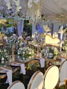 a table set up for a wedding with flowers at PNAF Farm resort in Pililla