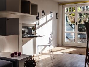 a living room with a table and a chair and a window at Kassel in Kassel