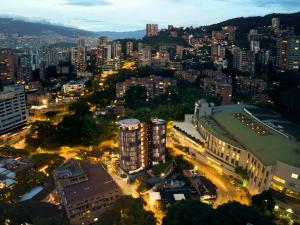 an aerial view of a city at night at Devú in Medellín