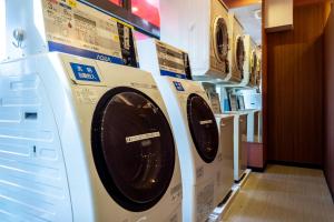 two washing machines are on display in a store at APA Hotel Kochi in Kochi