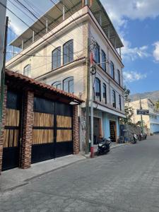a building on the side of a street at casa Borde Del Lago1 in Panajachel +5 photos