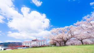 a group ofakura trees in front of a building at グリーンピア三陸みやこ in Miyako