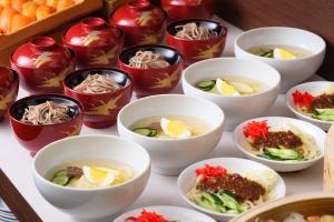 a group of bowls of food on a table at グリーンピア三陸みやこ in Miyako