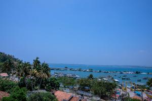a view of a harbor with boats in the water at Emerald Bay Resort Mirissa in Mirissa