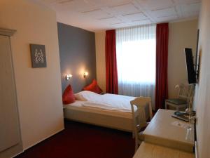 Voodi või voodid majutusasutuse Hotel Pfeffermühle toas