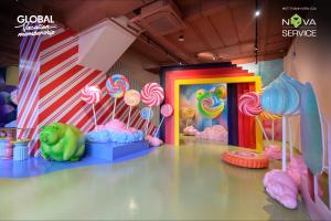 a room with a party with lollipops and a room with a cake at Biệt thự Hồ Tràm B SH42 in Xuyên Mộc