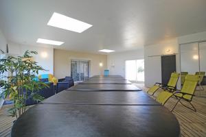 a large conference room with a long table and chairs at Le pin parasol in Arnac-la-Poste +46 photos