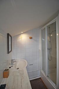 a white bathroom with a sink and a shower at Lou peyrahout in Javerdat +38 photos