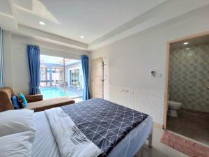 a bedroom with a bed and a swimming pool at Pool Marine Hua-Hin Private Poolvilla from beach 4 km in Hua Hin +31 photos