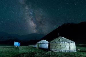 two domes in a field under a starry sky at Sunny Hostel in Osh