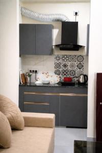 a kitchen with a counter top with a bowl on it at Rudra Homestay - Rishikesh in Rishīkesh +6 photos