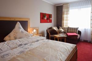 Voodi või voodid majutusasutuse Hotel Pfeffermühle toas