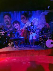 a group of people on a stage at Praça do Presidente in Santa Maria