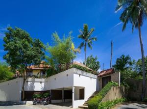 a white house with palm trees on top of it at 4 Bedroom Sea View Villa TG48 on Beach Front Resort SDV288-By Samui Dream Villas in Thong Son Beach