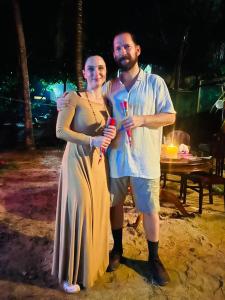 a man and a woman posing for a picture at Sun & Sea 365 in Balapitiya