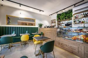 a restaurant with tables and chairs and a counter at B&B Lorenzo de' Medici in Florence