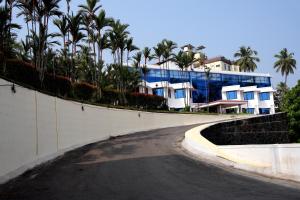 a skateboard ramp in front of a building with palm trees at KRISHNA HOLIDAY VILLAGE in Trichūr