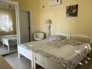 a bedroom with a large bed in a room at Bright house in Bar +22 photos
