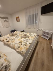 a bedroom with a large bed in a room at Urlaub am Weinhof Ramminger in Gleisdorf