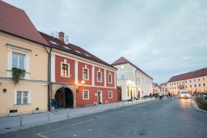 a street in a town with red and white buildings at Apartman Kaptol in Zagreb