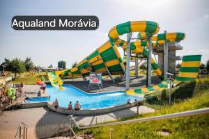 a large water park with a water slide at Pohádka- v srdci Pálavy a Lednice in Rakvice