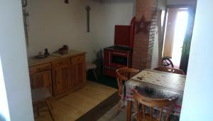 a small kitchen with a table and a stove at Holiday Home Stella in Žabljak