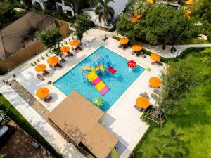 an overhead view of a swimming pool with umbrellas at Nai Yang Beach Resort and Spa in Nai Yang Beach
