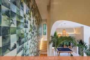a hallway with a pool table in a house at Bebas Villas - Uluwatu, Bali in Uluwatu +66 photos
