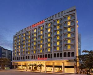 a hotel building with a sign on the side of it at Ramada Colombo in Colombo