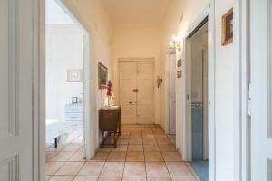 a hallway with a room with a bed and a table at Domus al Palatino in Rome