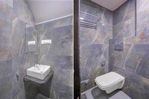 a bathroom with a toilet and a sink at FabHotel Beverly Plaza in Mumbai