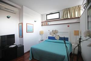 TV a/nebo společenská místnost v ubytování Residenza L'Isola Capri