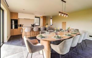 a dining room and kitchen with a table and chairs at 5 Bedroom Beautiful Home In Oudenaarde in Oudenaarde