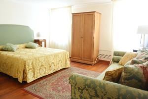 Postel nebo postele na pokoji v ubytování Hotel San Zulian