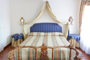 Postel nebo postele na pokoji v ubytování Hotel San Zulian