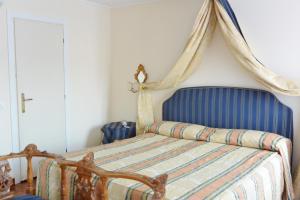 Postel nebo postele na pokoji v ubytování Hotel San Zulian