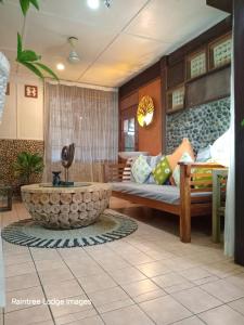 a room with a bed and a tub in a room at Raintree Lodge in Port Moresby