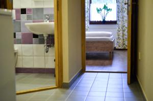 Postel nebo postele na pokoji v ubytování Páva Apartmanház