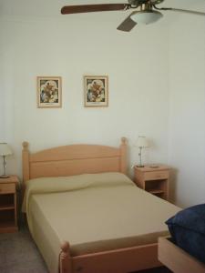 a bedroom with a bed and two night tables at Amelia in Ostende