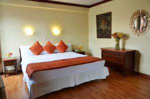Cama ou camas em um quarto em Royal Inka II