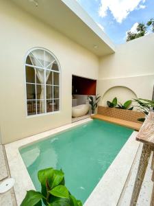 a swimming pool in the backyard of a house at At Paviliun With Private Pool in Timuran