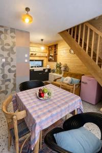 a dining room table with a bowl of fruit on it at Nastawka Cottage Creativity and Regeneration in Raciechowice