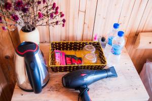 a table with a basket and bottles of water at Then Pa village in Loung Co
