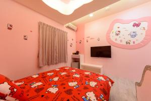 Postel nebo postele na pokoji v ubytování 安可的家 小孩及寵物免費 恆春老街夜市 屏東縣民宿0497