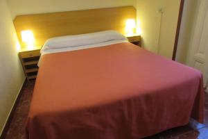 Postel nebo postele na pokoji v ubytování Hostal Prim