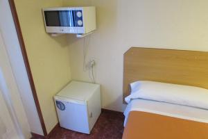 Postel nebo postele na pokoji v ubytování Hostal Prim