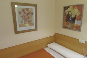 Postel nebo postele na pokoji v ubytování Hostal Prim